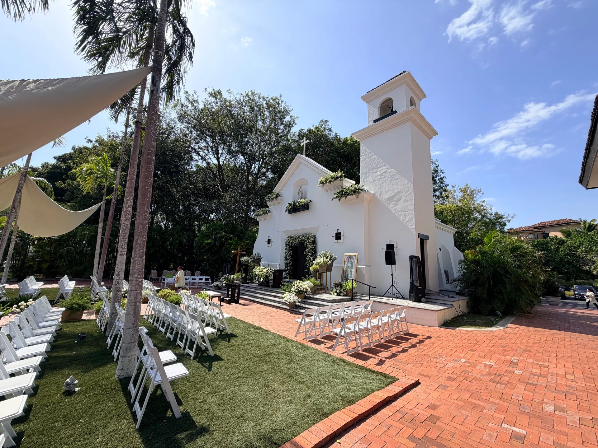 Outdoor wedding ceremony setup in front of a white chapel at Buenaventura Golf & Beach Resort, Panama.